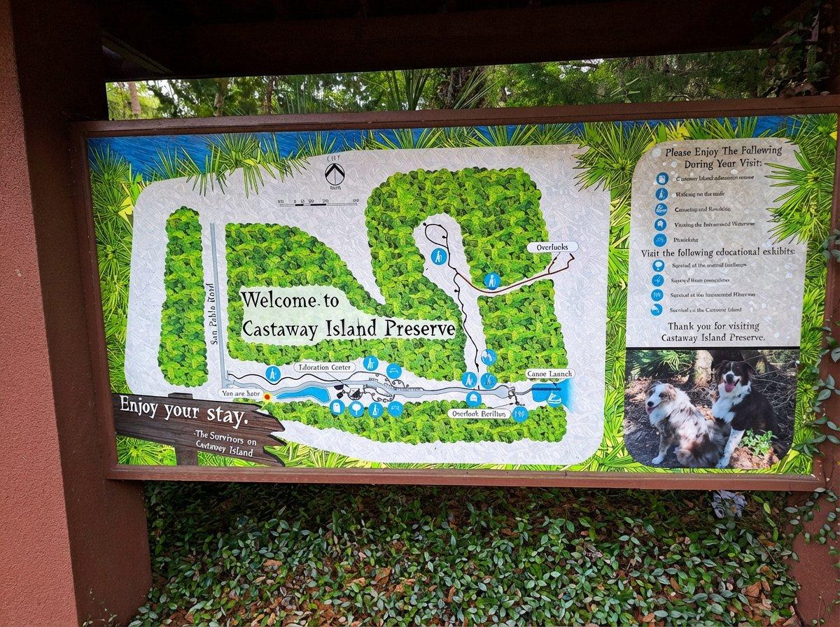 Welcome to Castaway Island Preserve trail map and entry sign with two dogs at the base, Jacksonville Florida