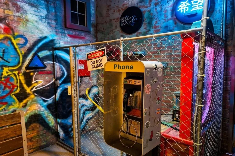 Mystery in Chinatown escape room — neon-lit back alley with phone booth, Mind Bender