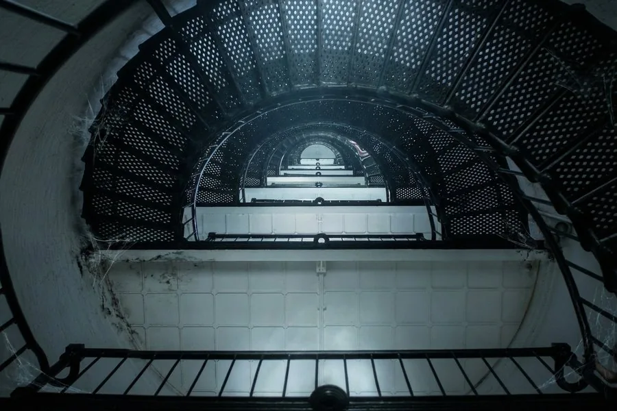 Looking up the spiral staircase inside the St. Augustine Lighthouse — 219 steps to the top